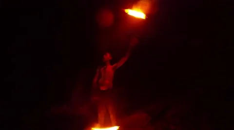 A Person With Bare Torso in the Darkness Doing Fire Show Stock Footage 66347239