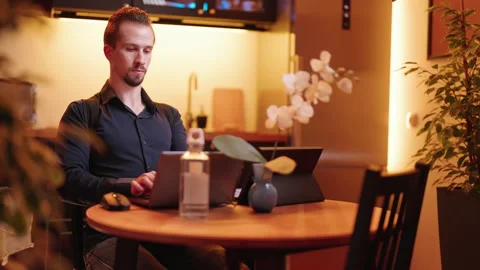 Person behind laptop computer wearing posture correction belt preventing pain 4K Stock Footage 170623655