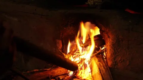 Person blowing air to the fire Stock Footage 295461306