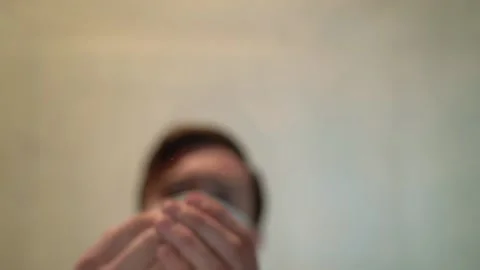 The person on the blurred background in slow motion throws the pills on a table Stock-Footage 130190163