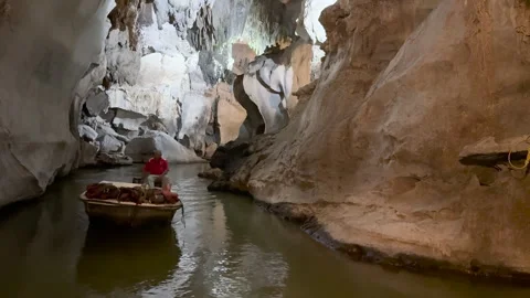 A person in a boat exploring İndian  Cave in Cuba Video stock 313274624