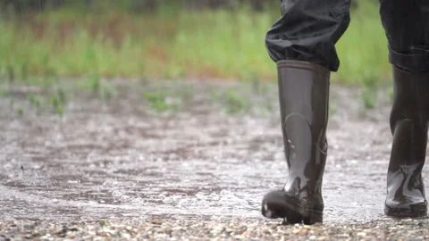 Person In Boots Walking In Water Stock Footage 200415824