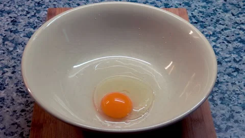 A person breaks the eggs. 動画素材 209948532