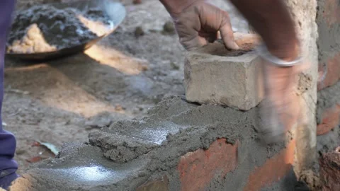 Person bricklaying bricks 스톡 동영상 332587583