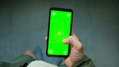 Person browsing green screen smartphone montage Stock Footage 313643109