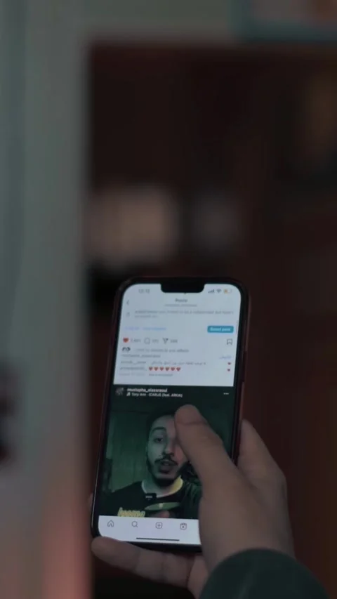Person Browsing Instagram on Smartphone in Low Light Stock Footage 309770733