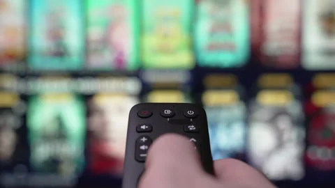 Person Browsing Streaming Services Using Remote Control. Stock Footage 284912288