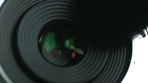 Person brushes over camera lens before taking photo Stock Footage 282076048