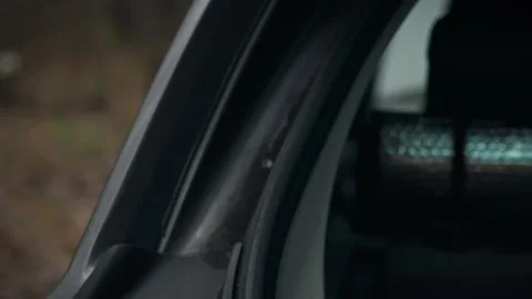 Person carefully opens vehicle trunk lid using handle releasing the lock on Stock Footage 331365897