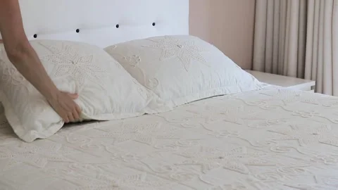 A person carefully performs a household task of making the bed Video stock 299335336