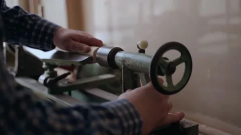 Person carving chisel candlestick on a lathe. Closeup of carpenter turning wood Video stock 194811159