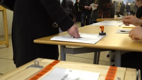 Person casting a vote into the ballot box during elections. Close up Stock Footage 74366777