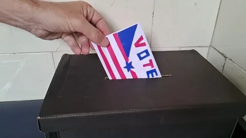 Person casting vote in ballot box for democratic election Stock Footage 341701353