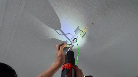 Person changing kitchen ceiling bulb. 스톡 동영상 338188874