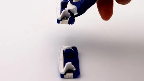 A person changing a razor blade Stock Footage 335872872