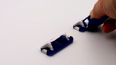 A person changing a razor blade Stock Footage 335906382