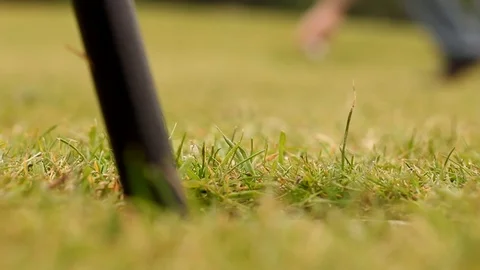 Person Cheating By Picking Up and Placing Golf Ball in The Hole Vídeo Stock 94508076