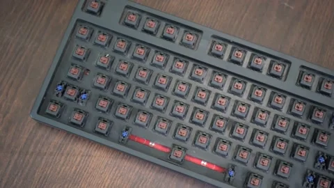 A person checking out his dirty mechanical keyboard without any keys Stock Footage 161326032