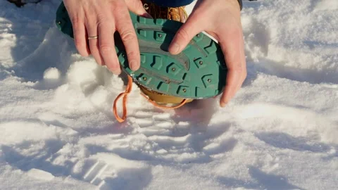 Person Checking Permanent Spikes Integrated into Sole of Winter Walking Shoe Video stock 301270999