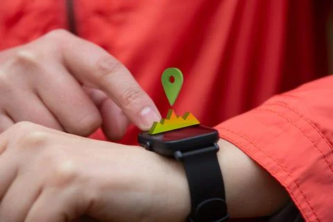 Person checking their smart watch during a workout Stock Photos
