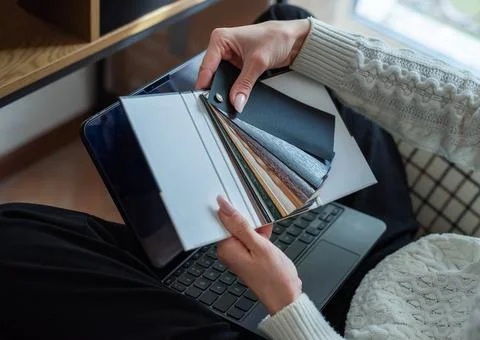 Person choosing material samples for interior design project Stock Photos