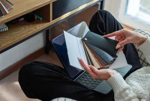 Person choosing material samples for interior design project Stock Photos