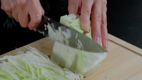 Person Chopping Cabbage in Cooking Kitchen Stock-Footage 341433787