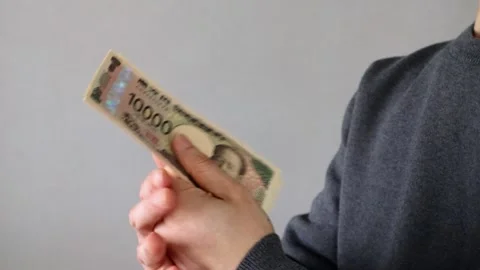 A person clapping and offering a banknote Stock Footage 324547294