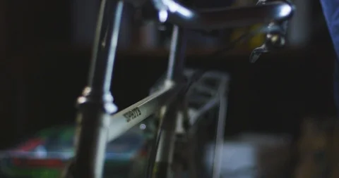 Person cleaning bicycle with cloth at workshop 動画素材 101216683