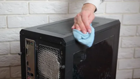 Person cleaning a dusty desktop computer case Stock Footage 334884496