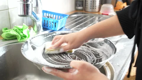 Person is cleaning pot using sponge and soap Video stock 260115842