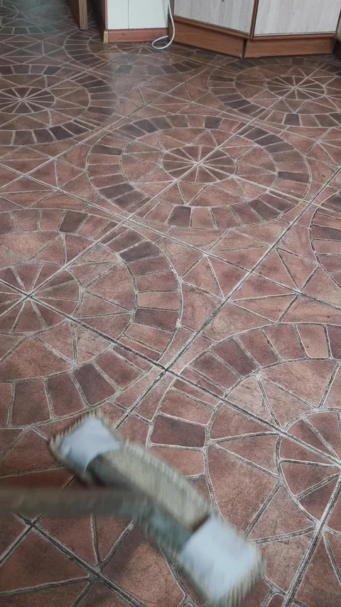 Person Cleaning Tiled Floor with Mop in Residential Interior Close Up View Stock Footage 329184910