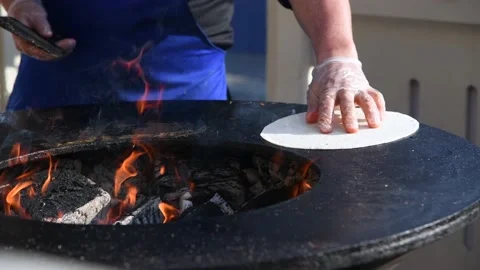 Person cleans grill surface Stock Footage 204813381