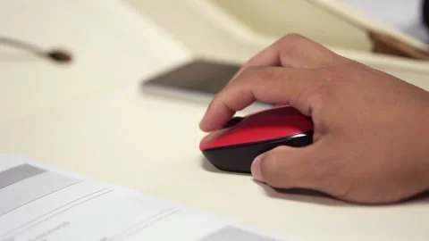 Person Clicking Red Computer Mouse On Office Desk Stockbeeldmateriaal 347206363