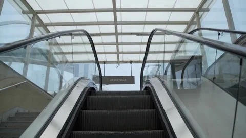 A person is climbing up the escalator. Stock Footage 311844649