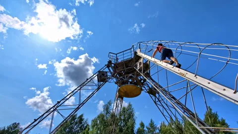 Person climbs ladder of RT-32 radio telescope relic used for space Stock Footage 282186933