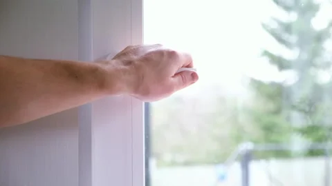 A person closes an open window after airing. A well-ventilated room. The concept Stock Footage 321934183