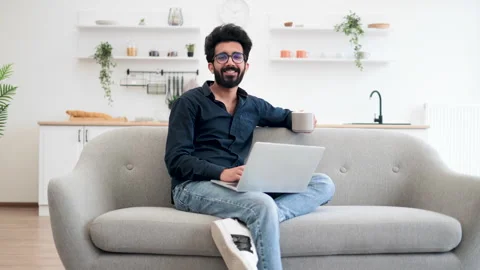 Person with coffee blogging via portable computer at home Stock Footage 244281457