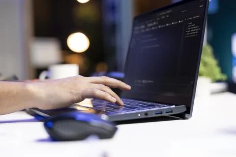 Person computing software code on laptop Stock Photos
