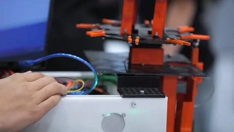 Person configures 3D printer setup Видео 344644516