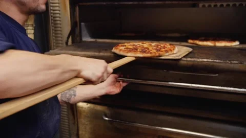 A person cooking in the oven Stock Footage 155451408