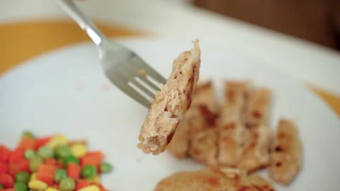 Person cooking a plant-based burger in a modern kitchen. Meat alternative. Stock Footage 338331372