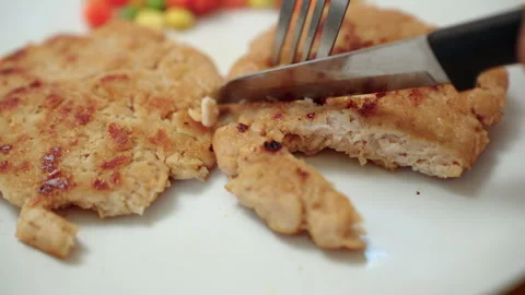 Person cooking a plant-based burger in a modern kitchen. Meat alternative. Stock Footage 338331383