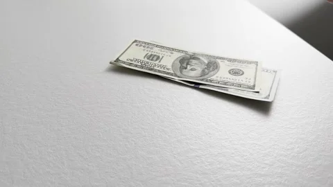 Person counting dollar banknotes at a dimly lit desk in the evening. Hands .. Stock Footage 320474986