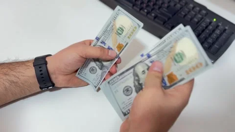 Person Counting Dollar Bills Stock Footage 297730801