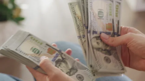 Person Counting Large Stack of Hundred Dollar Bills Stock Footage 275815640