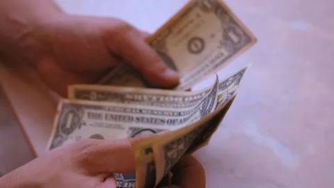 Person counting one dollar bills cash Stock Footage 323950613