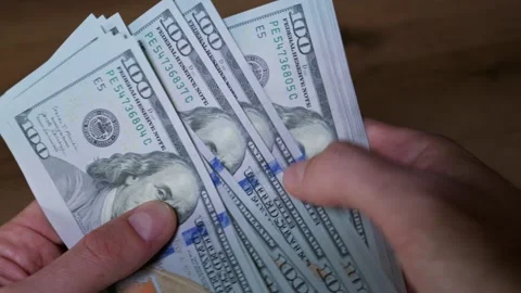 Person Counting Stack of One Hundred Us Dollar Bills Close Up Stock Footage 339205185