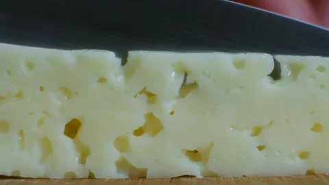 Person cut slice cheese close up Video stock 241468413