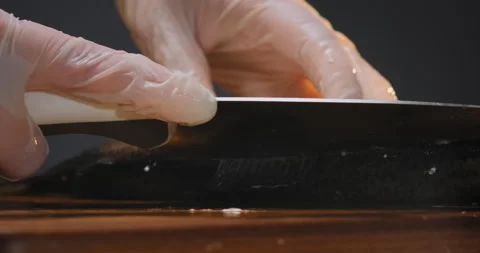 Person cuts back of red fish with sharp knife on board 스톡 동영상 149596189